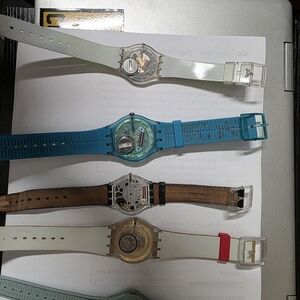 Swatch Smartwatches in Blue, Brown, and White